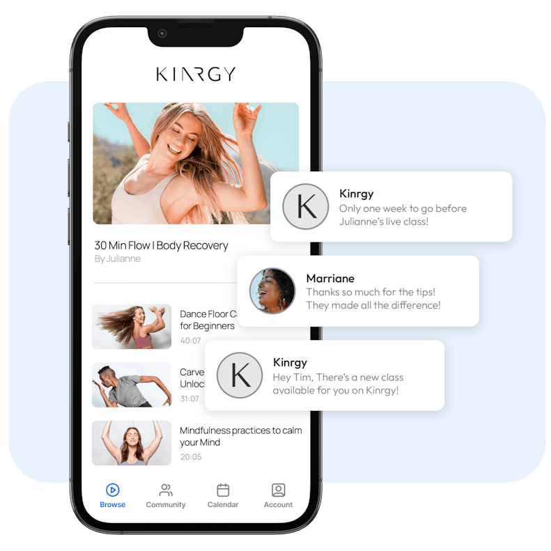 Smartphone screen displaying 'KINRGY' fitness and wellness app with a variety of workout options like '30 Min Flow Body Recovery' and 'Dance Floor Cardio for Beginners', along with user testimonials and reminders for upcoming live classes.